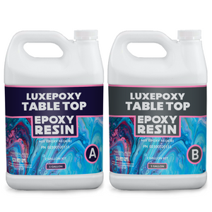 Two white plastic gallon jugs sitting side by side. Part A epoxy resin and Part B hardener with blue, pink and gray labels.