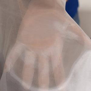 Very thin and delicate 1.5 ounce fiberglass fabric. Hand shown under the fabric to show the thickness.