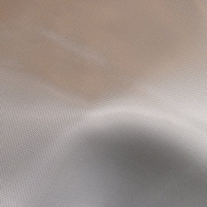Close up of 8.9 ounce style 7781 aerospace fiberglass cloth. Satin weave fabric..